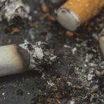 Cigarette.Closeup cigarette and cigarette butt on the floor.World No Tobacco Day Concept Stop Smoking.